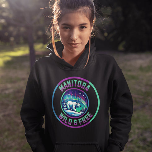 Embrace the power and beauty of the north with our Manitoba – Wild & Free hoodie, featuring a bold graphic of a polar bear beneath the awe-inspiring northern lights.